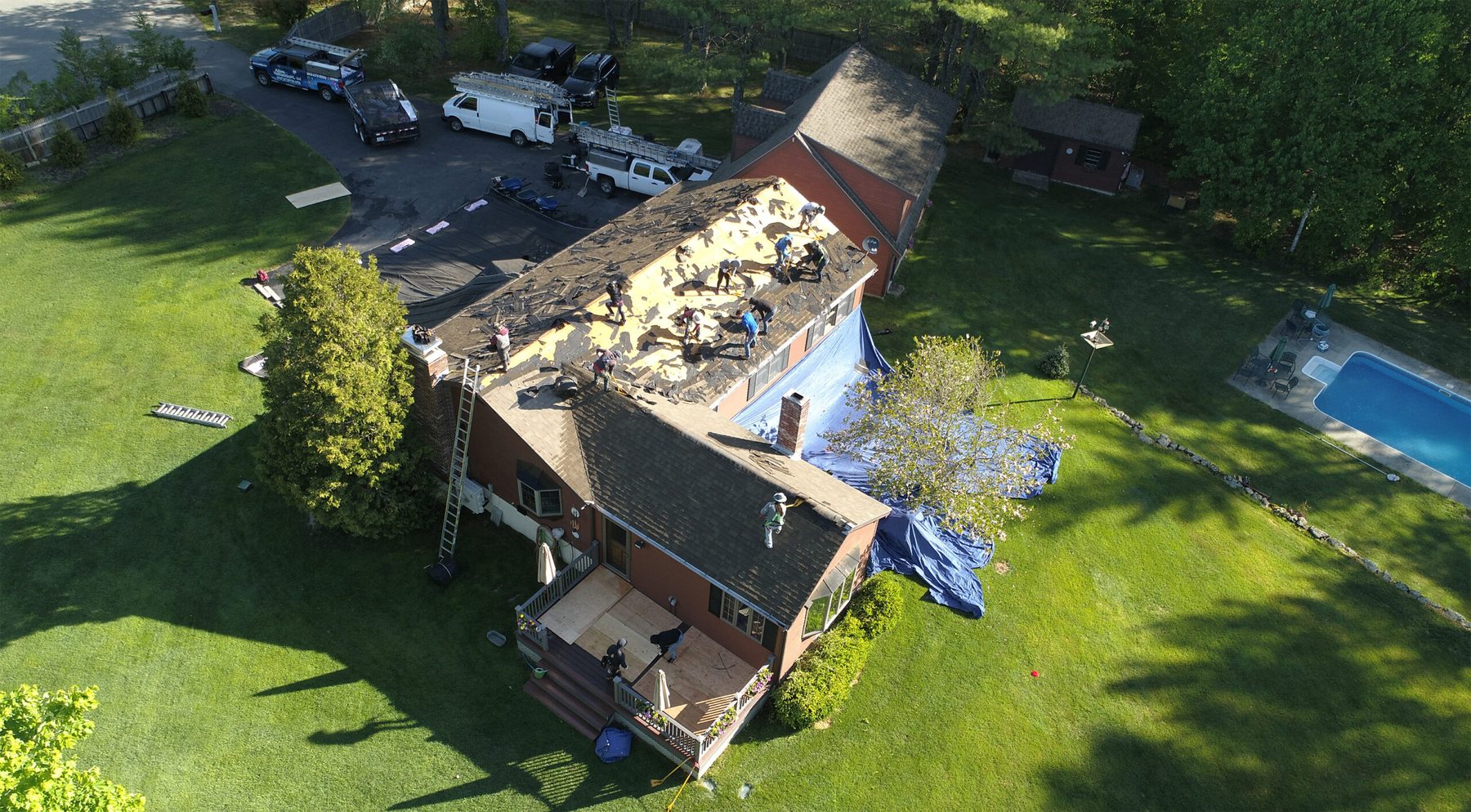 Aerial view of an Oklahoma home with storm damaged roofing