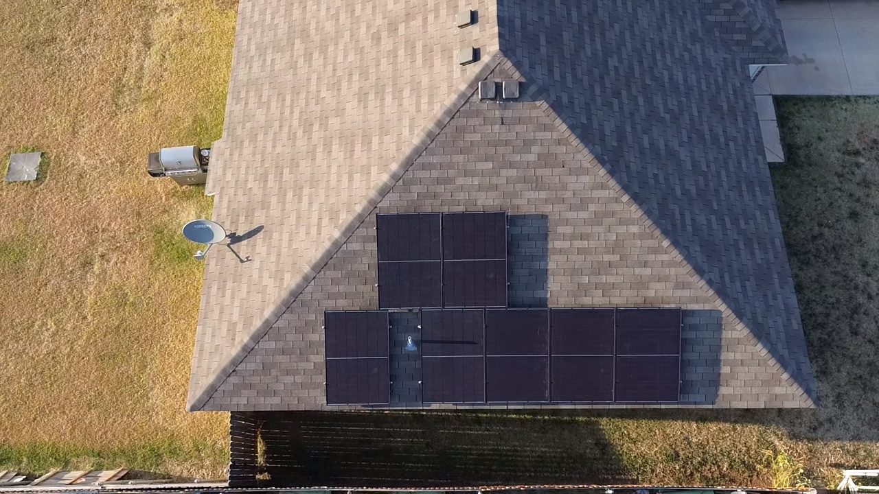 Solar array on a shingle roof before a detach and reset